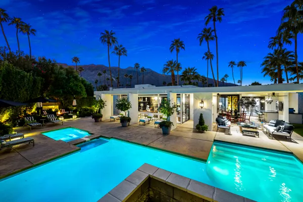 a view of a swimming pool with a patio