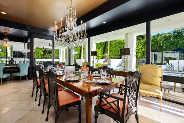 a view of a dining room with furniture window and outside view