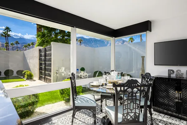 a view of an outdoor dining space with furniture