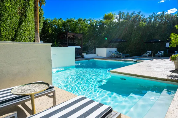 a view of a backyard with sitting area
