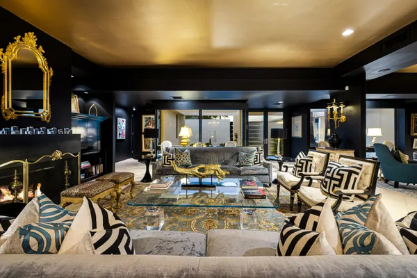 a living room with lots of furniture and white walls