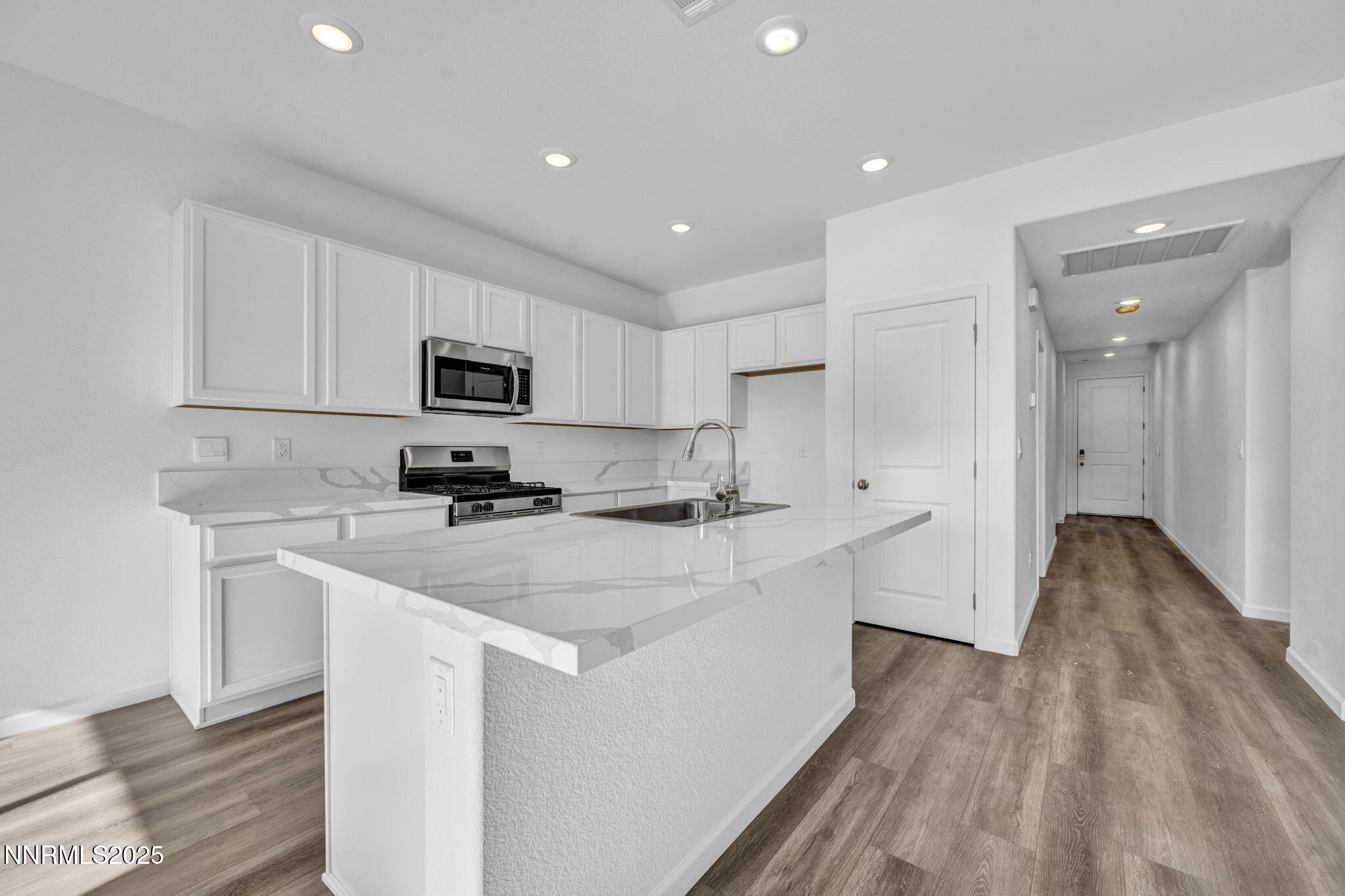 8470 Endor Drive, Unit LOT 15 Reno, NV 89506 - Photo 12 of 27 a kitchen with sink a microwave and refrigerator
