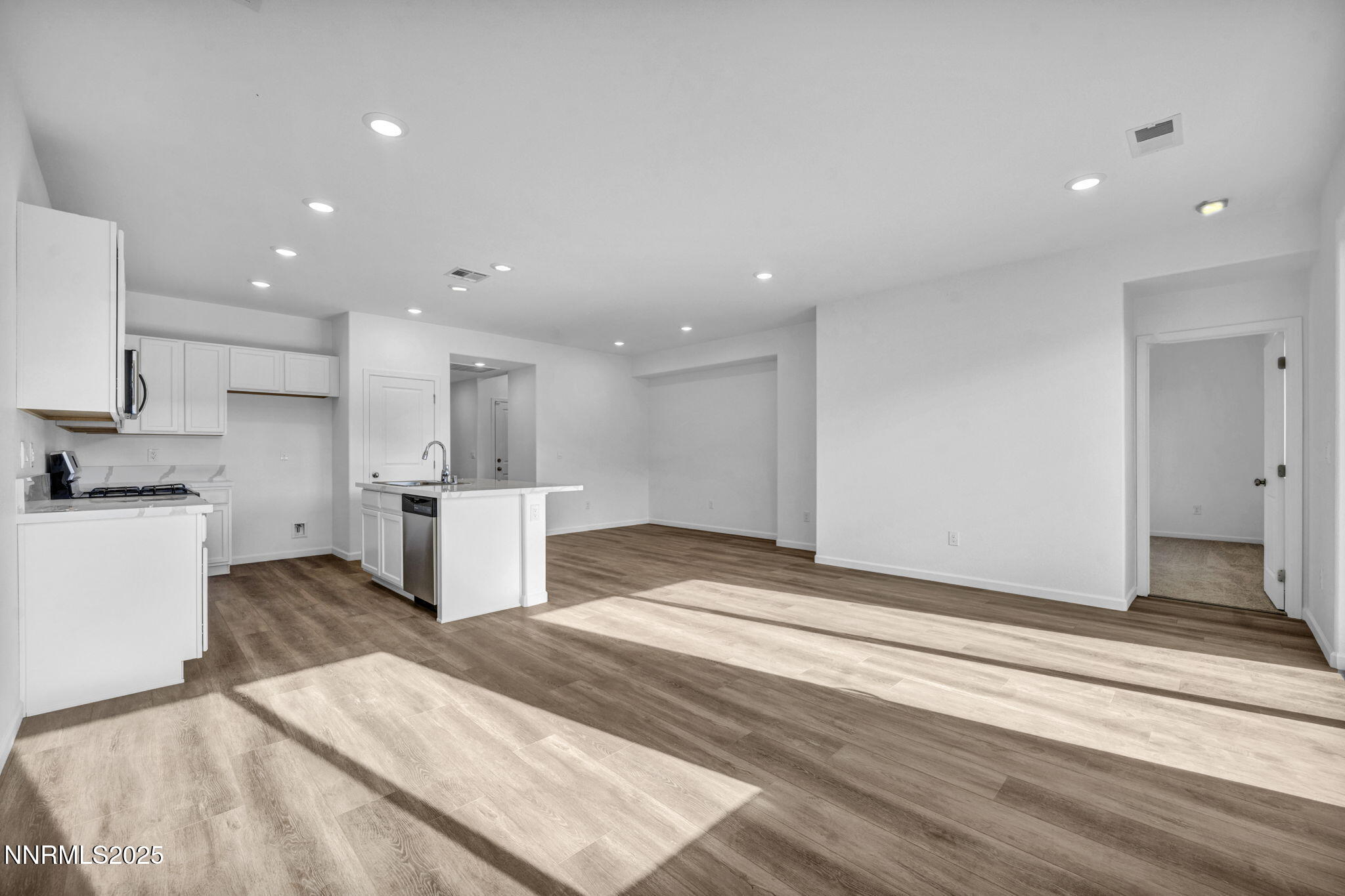 8470 Endor Drive, Unit LOT 15 Reno, NV 89506 - Photo 14 of 27 a view of kitchen with kitchen island sink refrigerator and stove