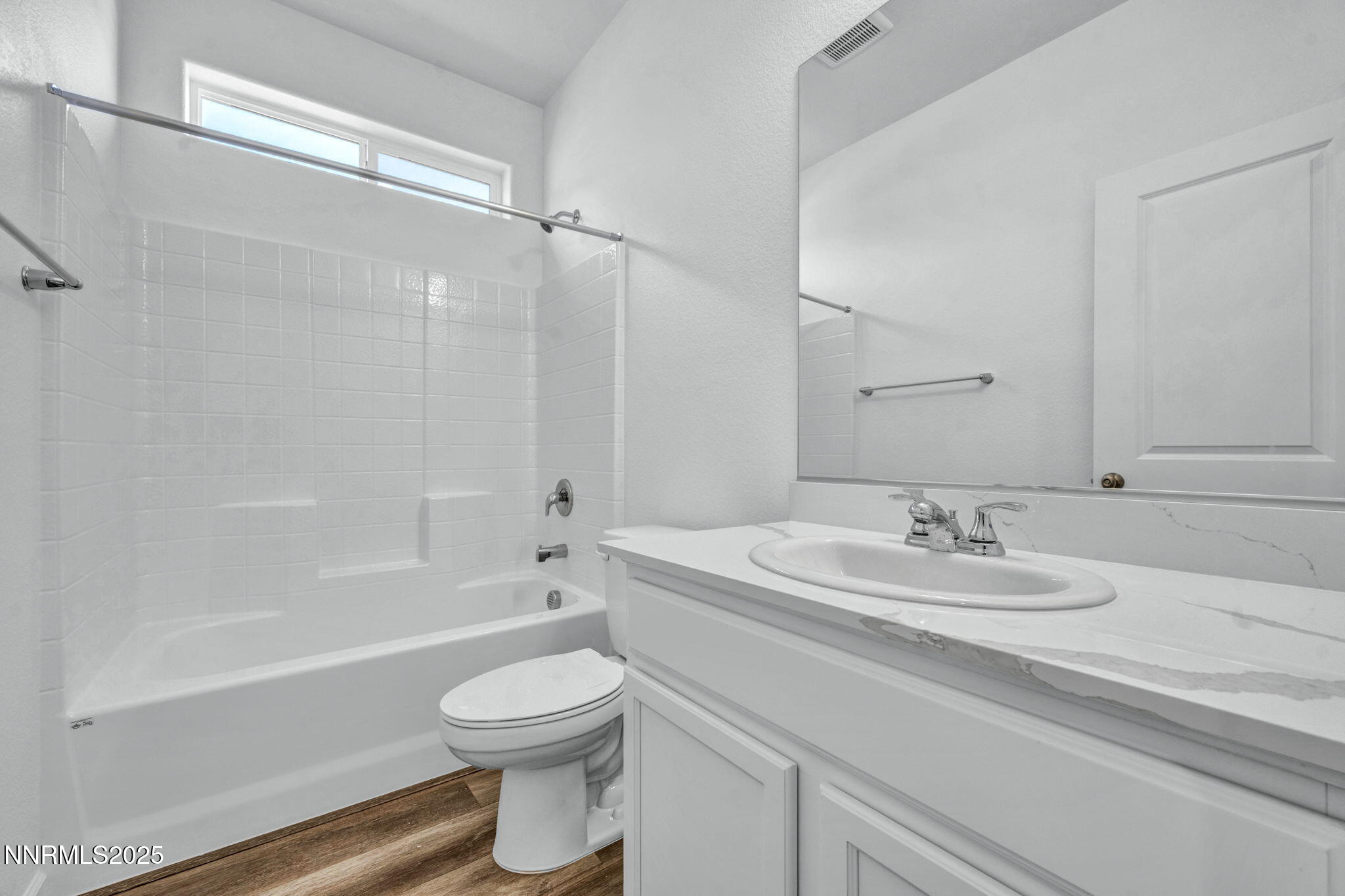 8470 Endor Drive, Unit LOT 15 Reno, NV 89506 - Photo 19 of 27 a bathroom with a sink a toilet and a bathtub