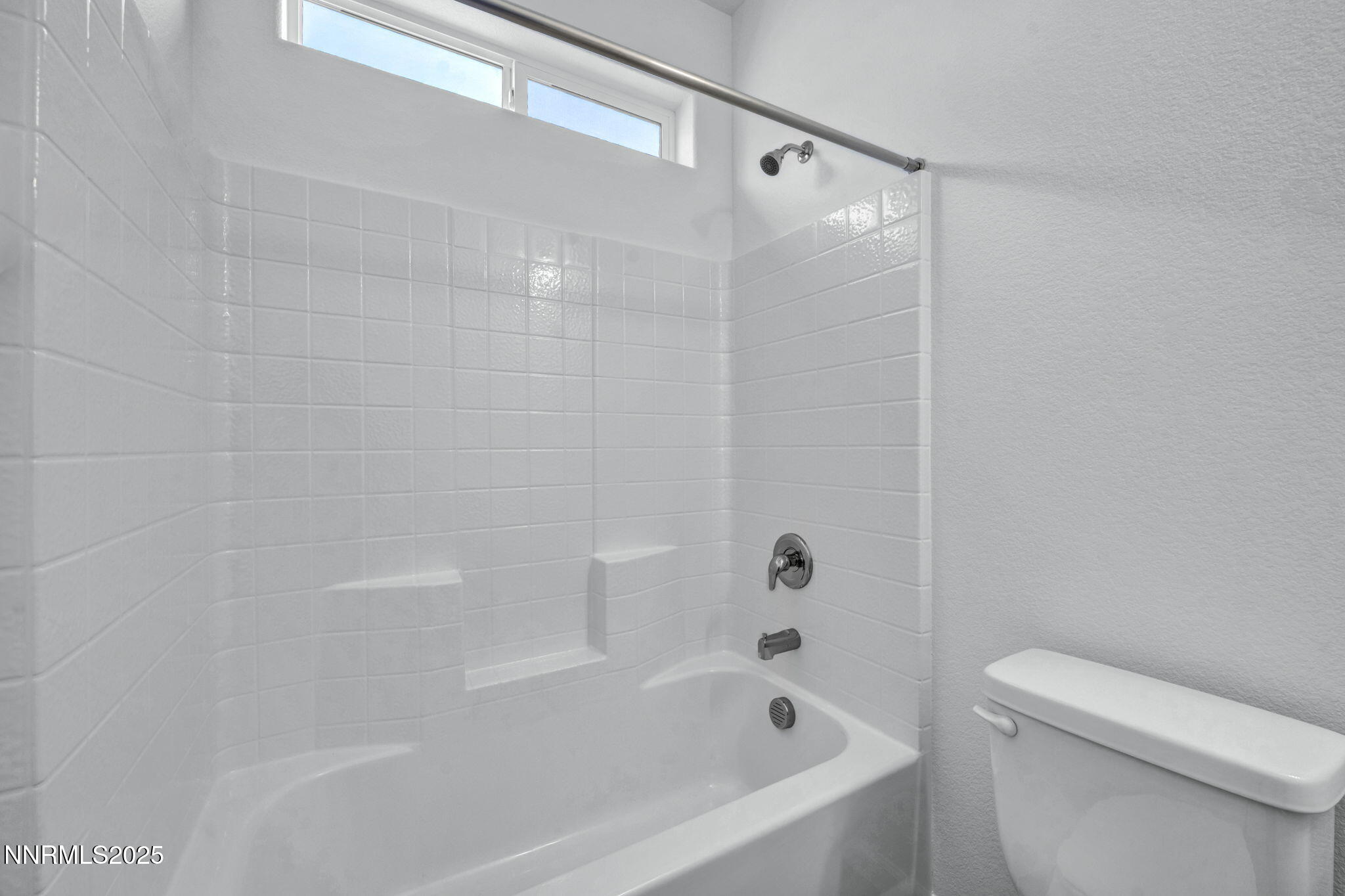 8470 Endor Drive, Unit LOT 15 Reno, NV 89506 - Photo 20 of 27 a bathroom with a bathtub and a toilet