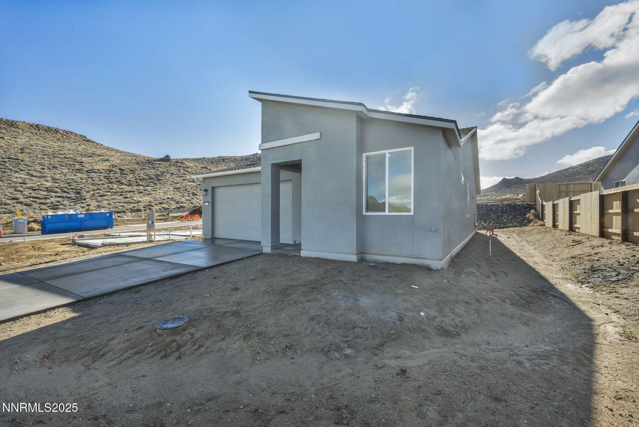 8470 Endor Drive, Unit LOT 15 Reno, NV 89506 - Photo 2 of 27 a view of a house with a street