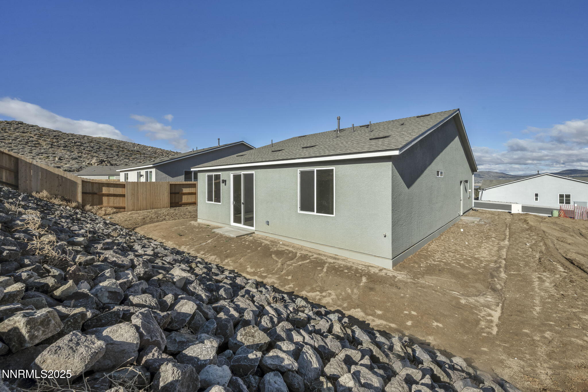 8470 Endor Drive, Unit LOT 15 Reno, NV 89506 - Photo 5 of 27 a backyard of a house with a large tree