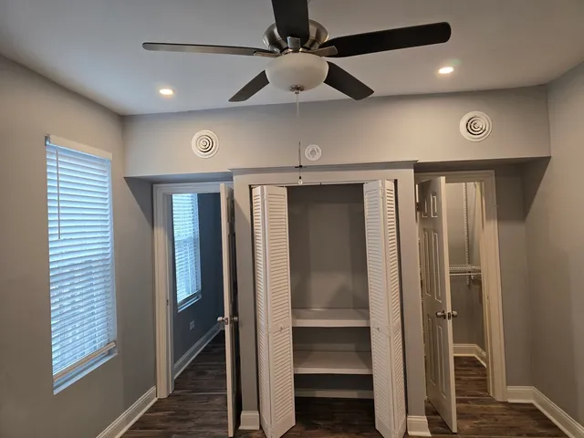 a view of a hallway with a glass door