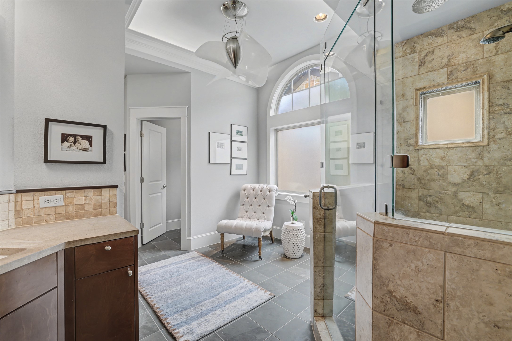 816 Stonewall Ridge Lane Austin, TX 78746 - Photo 20 of 32 Should you love to relax with a bath, the chair area could replaced with a soaking tub.