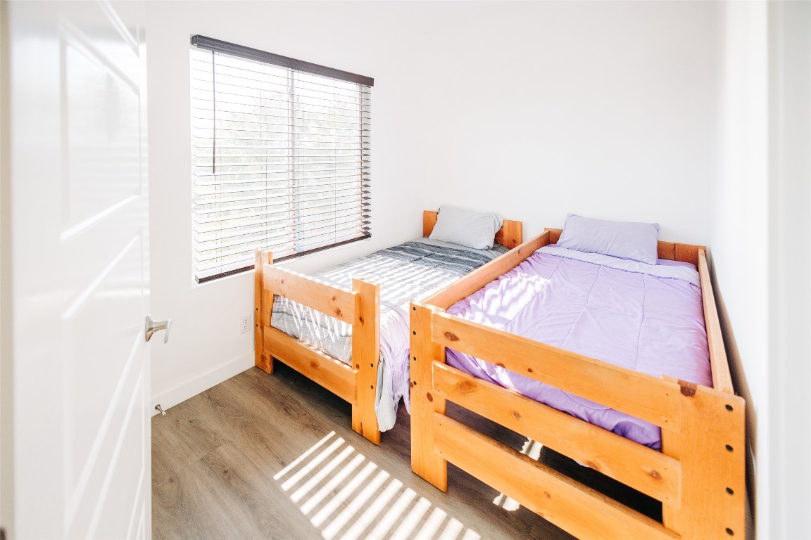 12500 Lamppost Lane, Unit 17 Austin, TX 78727 - Photo 12 of 19 a bedroom with a bed and a window