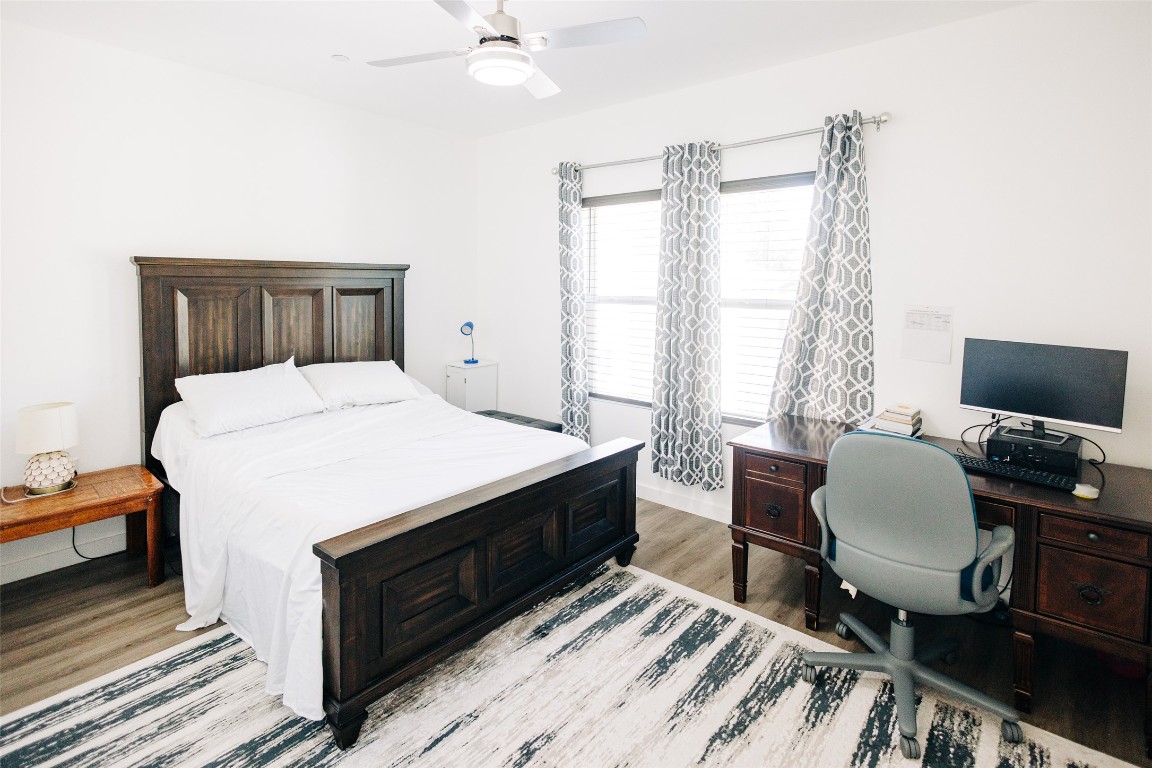 12500 Lamppost Lane, Unit 17 Austin, TX 78727 - Photo 15 of 19 a bedroom with a bed and a desk