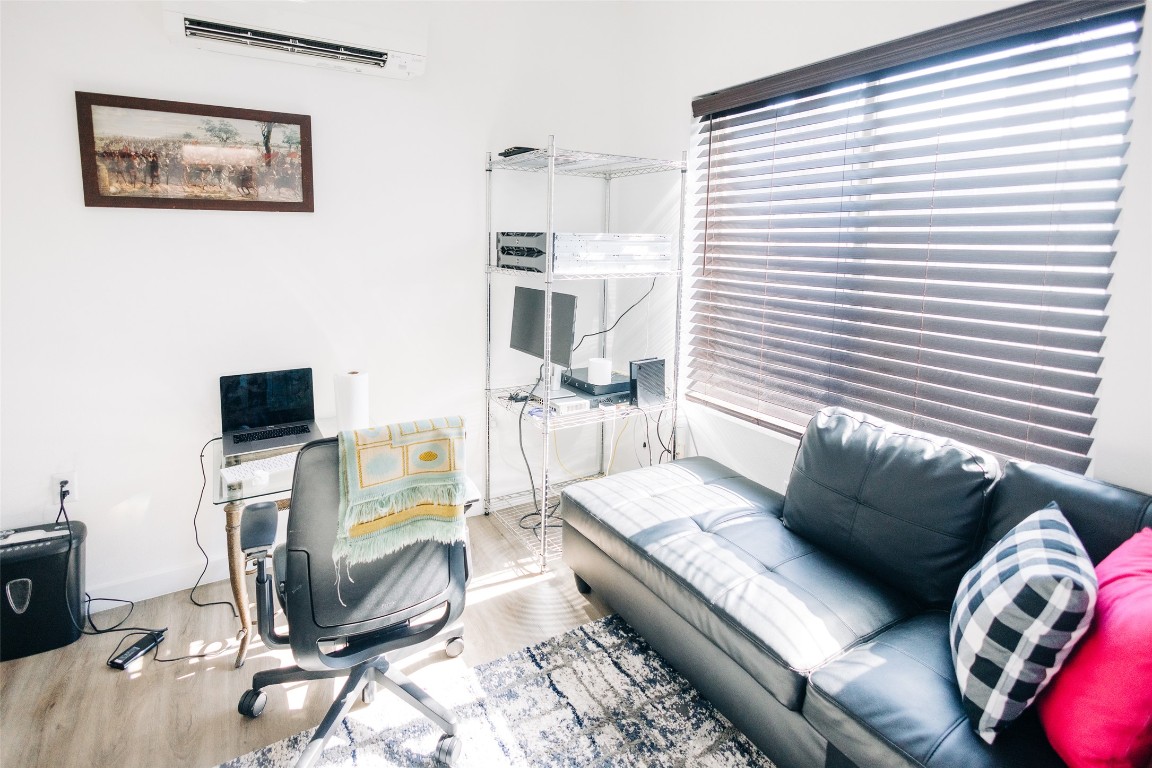 12500 Lamppost Lane, Unit 17 Austin, TX 78727 - Photo 3 of 19 a living room with furniture and a flat screen tv