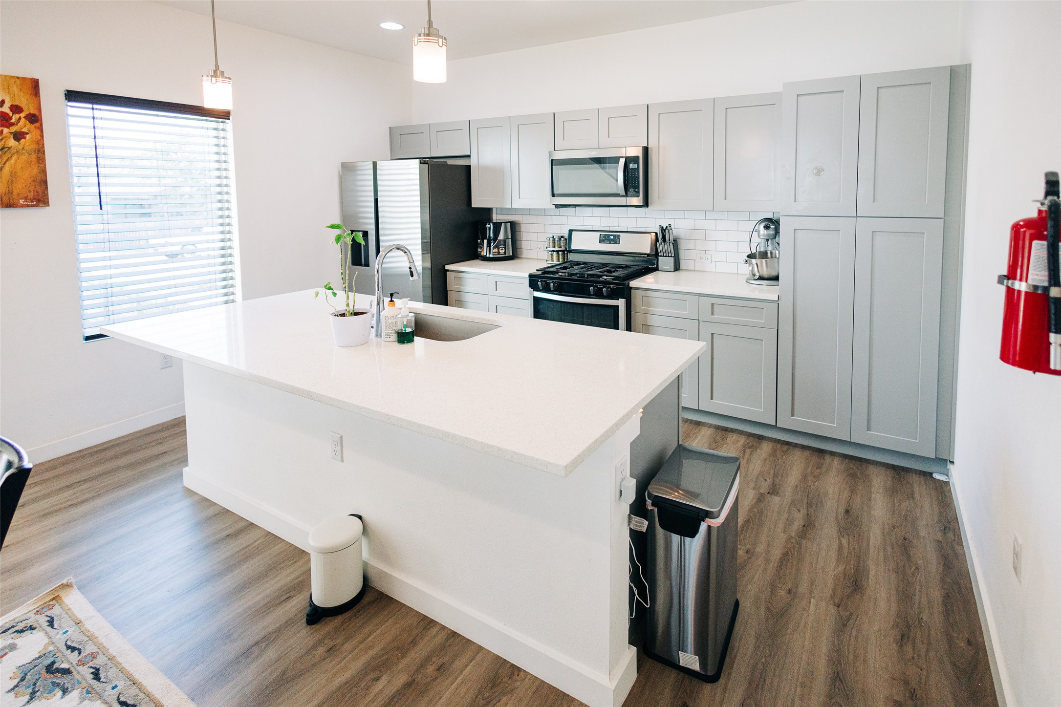 12500 Lamppost Lane, Unit 17 Austin, TX 78727 - Photo 6 of 19 a kitchen with a sink appliances and wooden floor