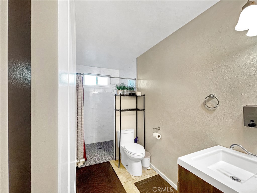 4084 137th Street, Unit B Hawthorne, CA 90250 - Photo 5 of 8 a bathroom with a sink toilet and shower
