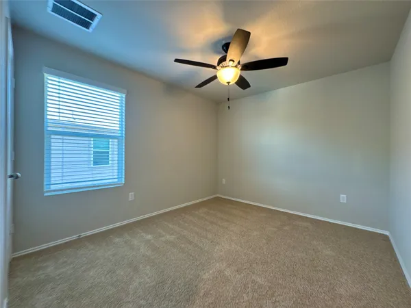 en view of an empty room with a window
