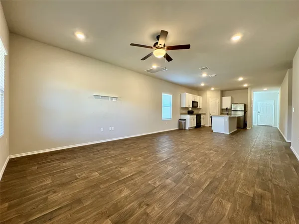 a view of a livingroom with a kitchen