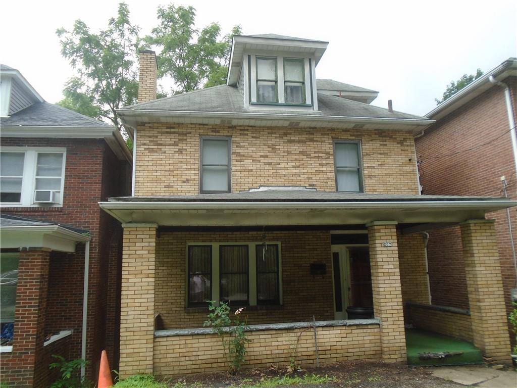 a view of a stone house with large windows