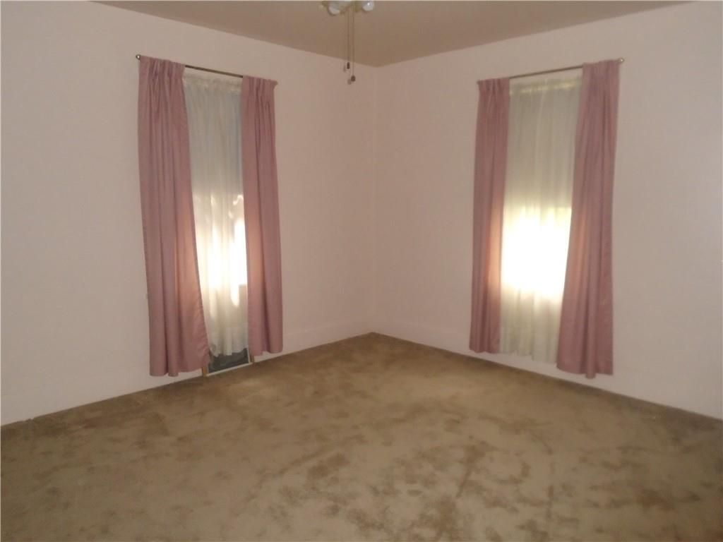 207 Locust Street Ambridge, PA 15003 - Photo 12 of 19 an empty room with windows and closet