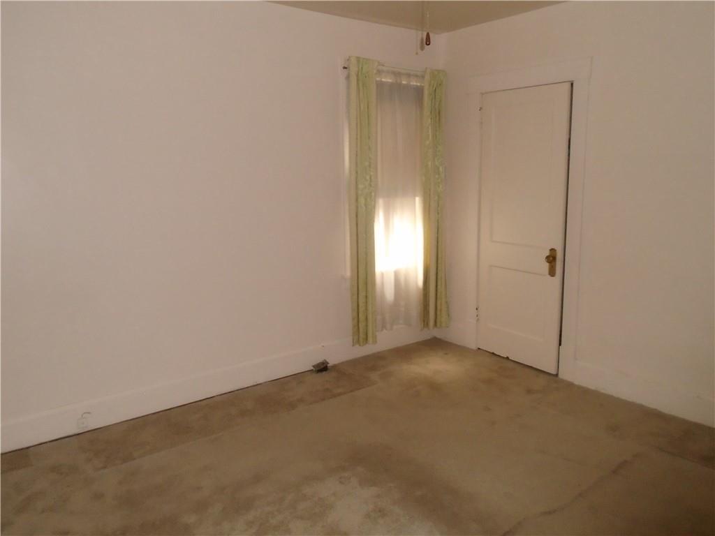207 Locust Street Ambridge, PA 15003 - Photo 13 of 19 an empty room with windows and closet