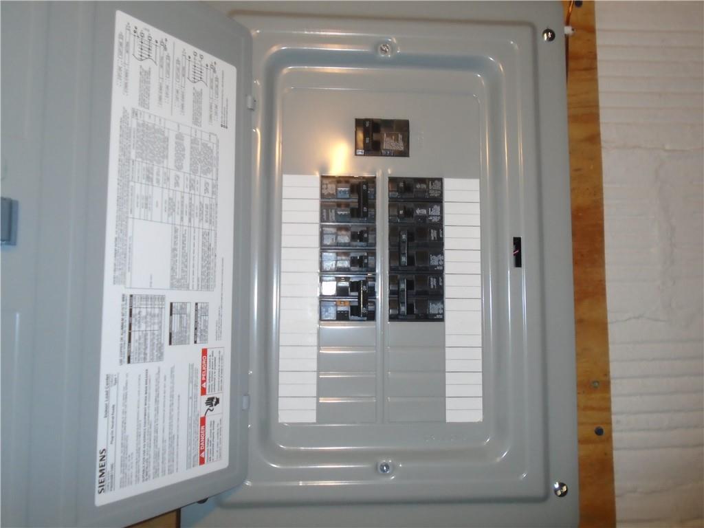 207 Locust Street Ambridge, PA 15003 - Photo 16 of 19 a view of a hallway with wooden shelves