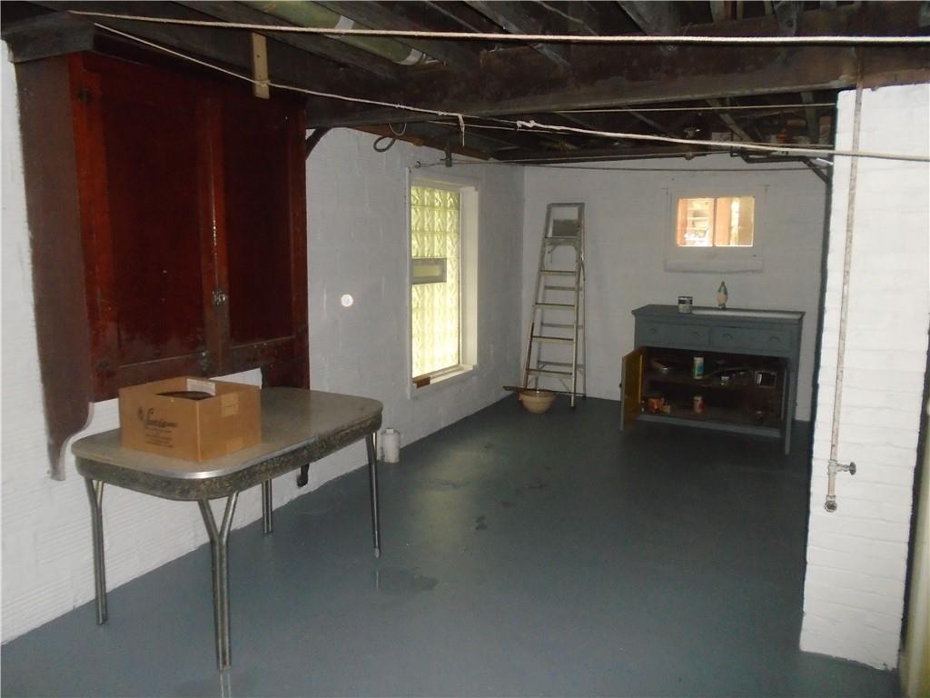 207 Locust Street Ambridge, PA 15003 - Photo 17 of 19 a room with a table and chairs