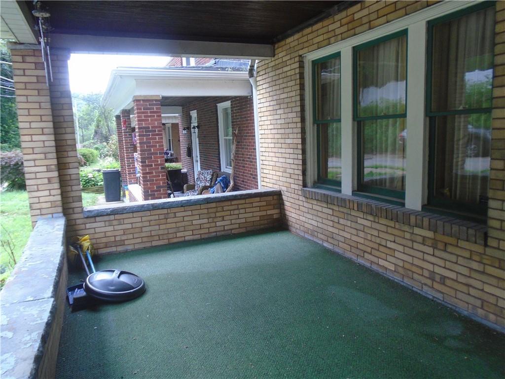 207 Locust Street Ambridge, PA 15003 - Photo 3 of 19 a view of a porch with furniture and wooden floor