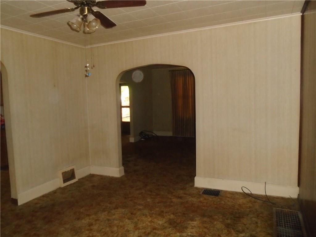 207 Locust Street Ambridge, PA 15003 - Photo 7 of 19 a view of a livingroom with a staircase