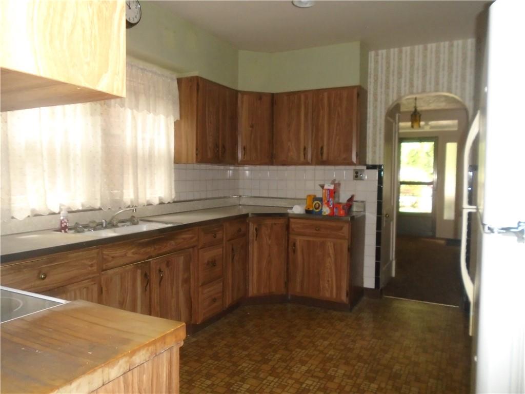 207 Locust Street Ambridge, PA 15003 - Photo 9 of 19 a kitchen with a sink cabinets and window