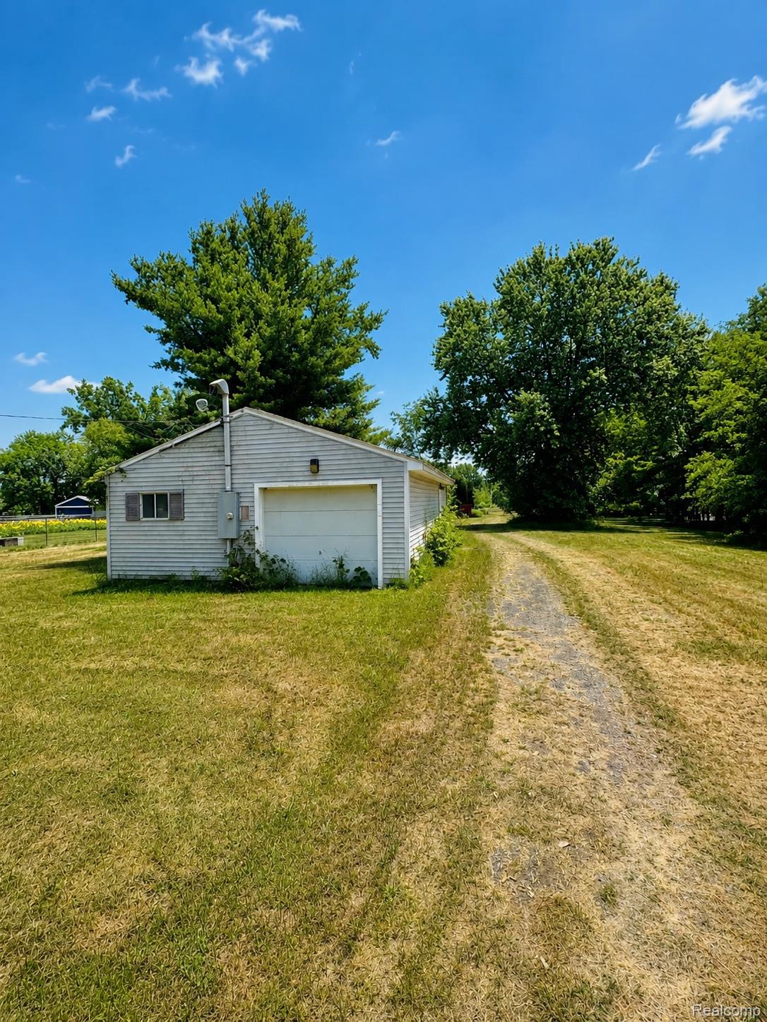 5454 Hopkins Road Flint, MI 48506 - Photo 10 of 13 38_summer_afternoon_in_a_tranquil_yard.jpg