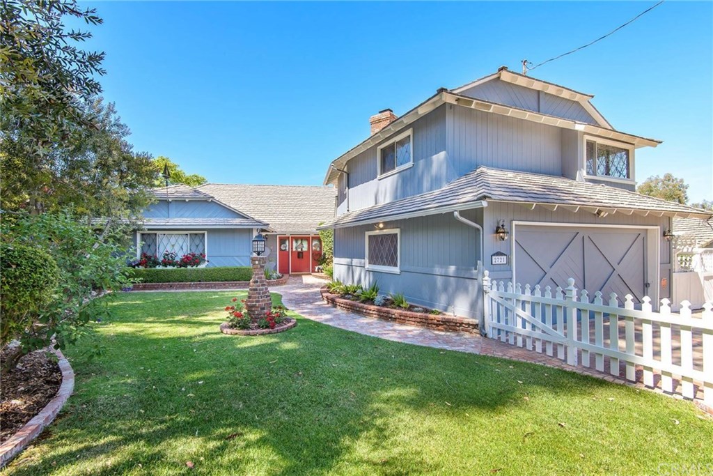 a view of a house with a yard from a patio