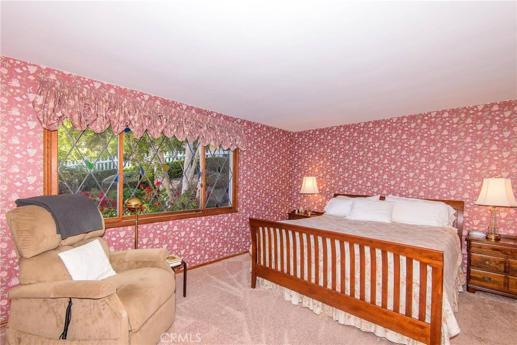 2721 Coral Ridge Road Rancho Palos Verdes, CA 90275 - Photo 11 of 24 a bedroom with a bed and wooden floor