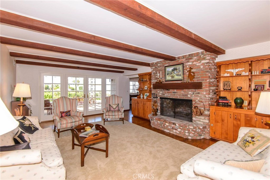 2721 Coral Ridge Road Rancho Palos Verdes, CA 90275 - Photo 5 of 24 a living room with furniture and a fireplace