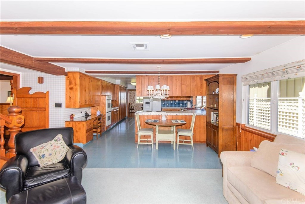 2721 Coral Ridge Road Rancho Palos Verdes, CA 90275 - Photo 8 of 24 a dining room with furniture and a kitchen view