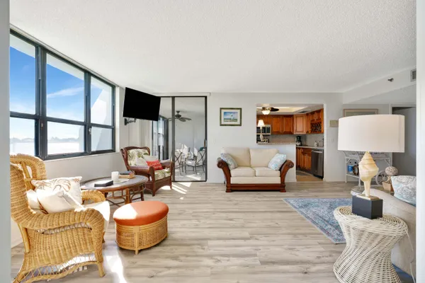 a kitchen with stainless steel appliances granite countertop a stove microwave and cabinets