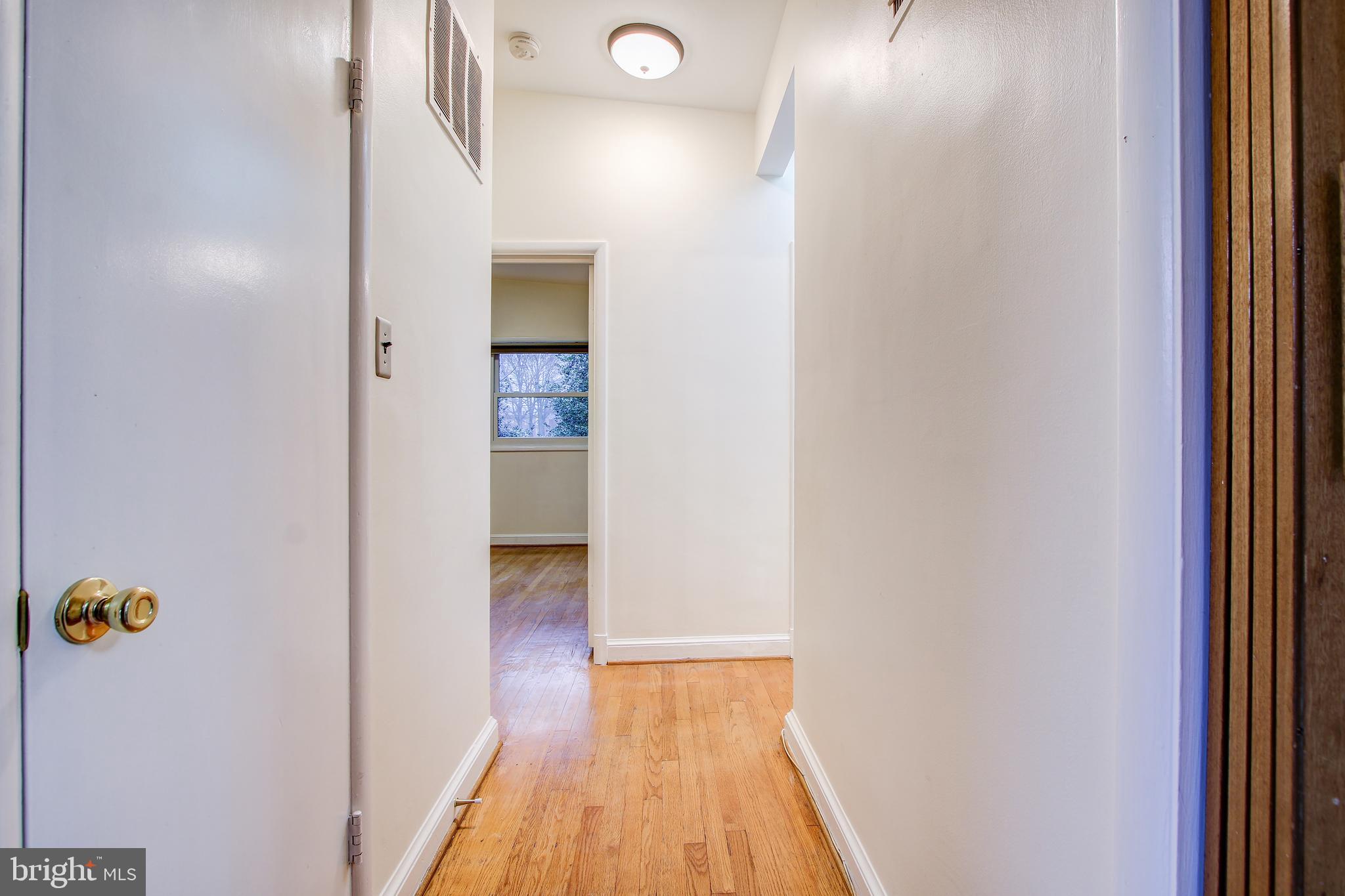 6006 28th Street Northwest Washington, DC 20015 - Photo 12 of 30 a view of a hallway with wooden floor