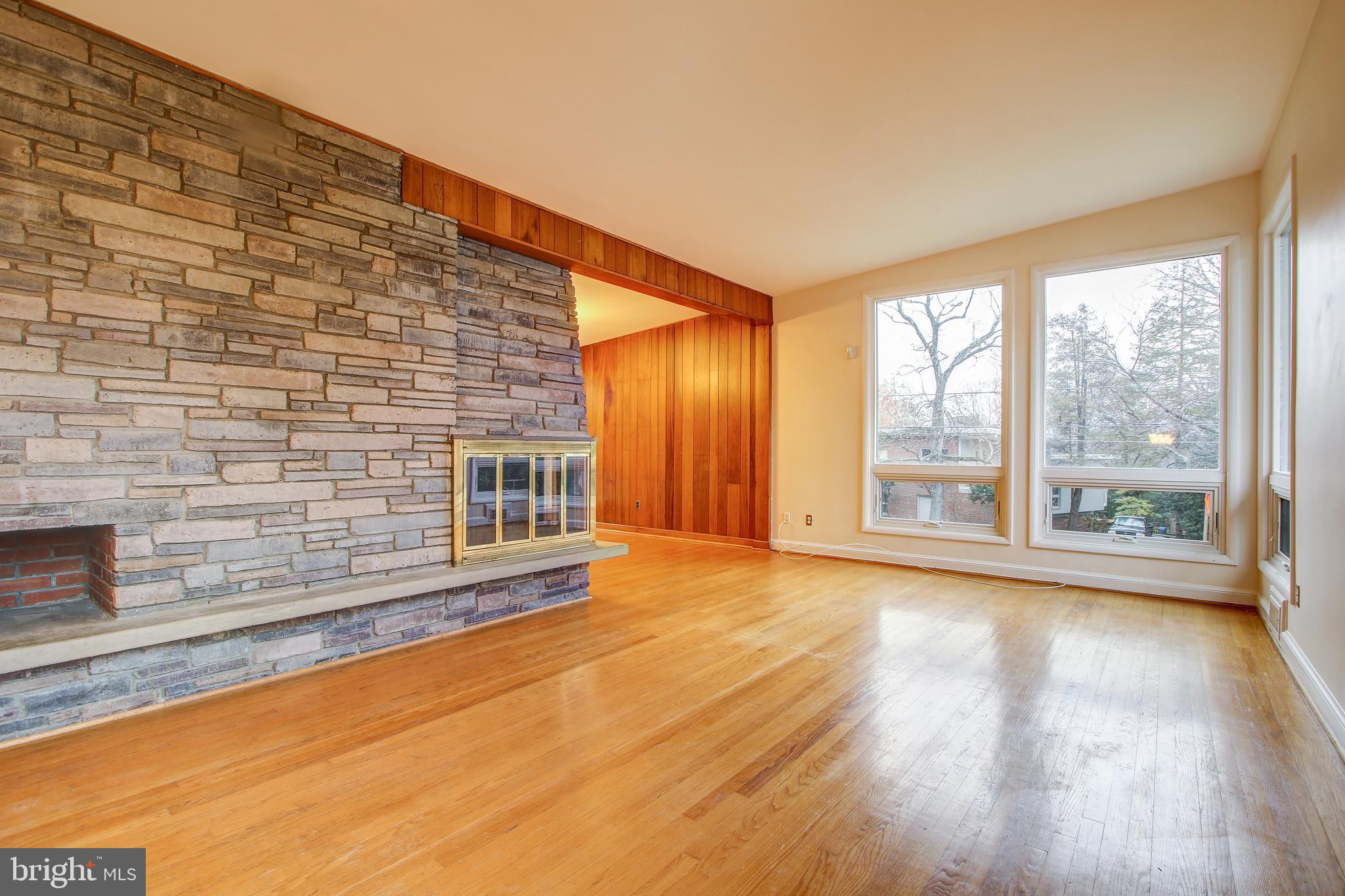 6006 28th Street Northwest Washington, DC 20015 - Photo 6 of 30 a view of an empty room with wooden floor and a window