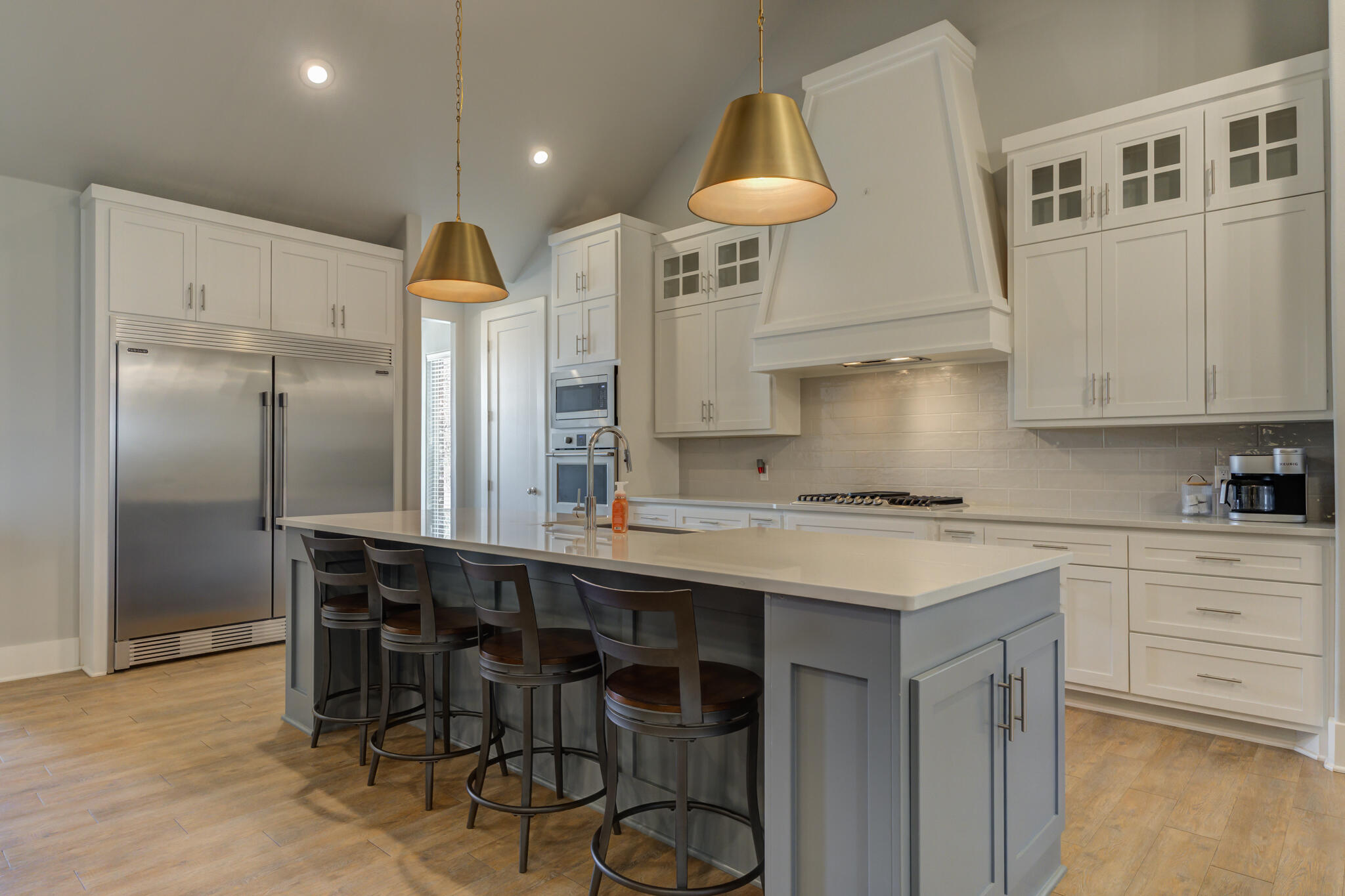 3918 137th Street Lubbock, TX 79423 - Photo 15 of 64 a kitchen that has a lot of cabinets in it and stainless steel appliances