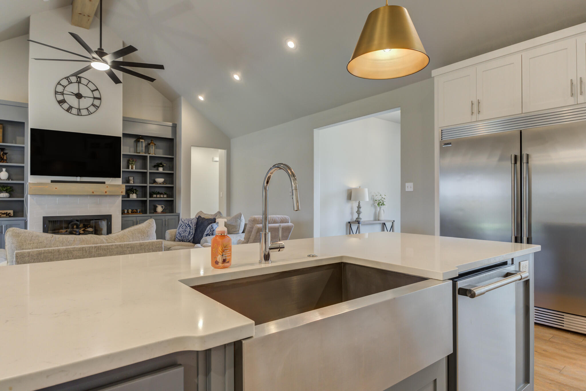 3918 137th Street Lubbock, TX 79423 - Photo 18 of 64 a kitchen with a refrigerator a sink and a stove with wooden floor