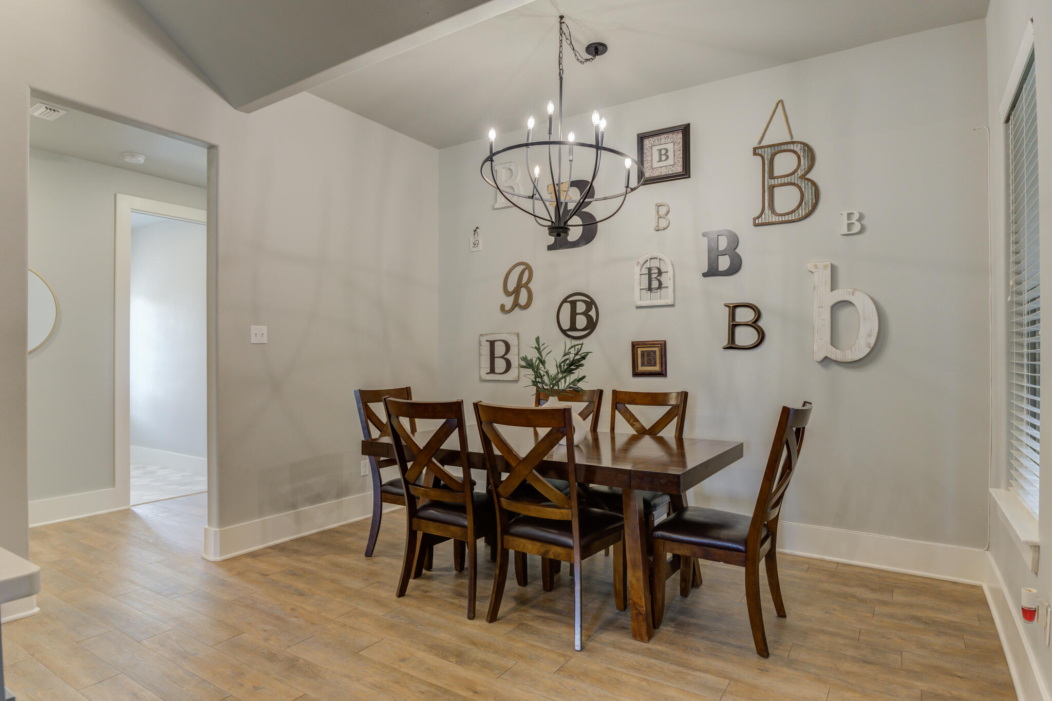 3918 137th Street Lubbock, TX 79423 - Photo 20 of 64 a view of a dining room with furniture wooden floor and chandelier