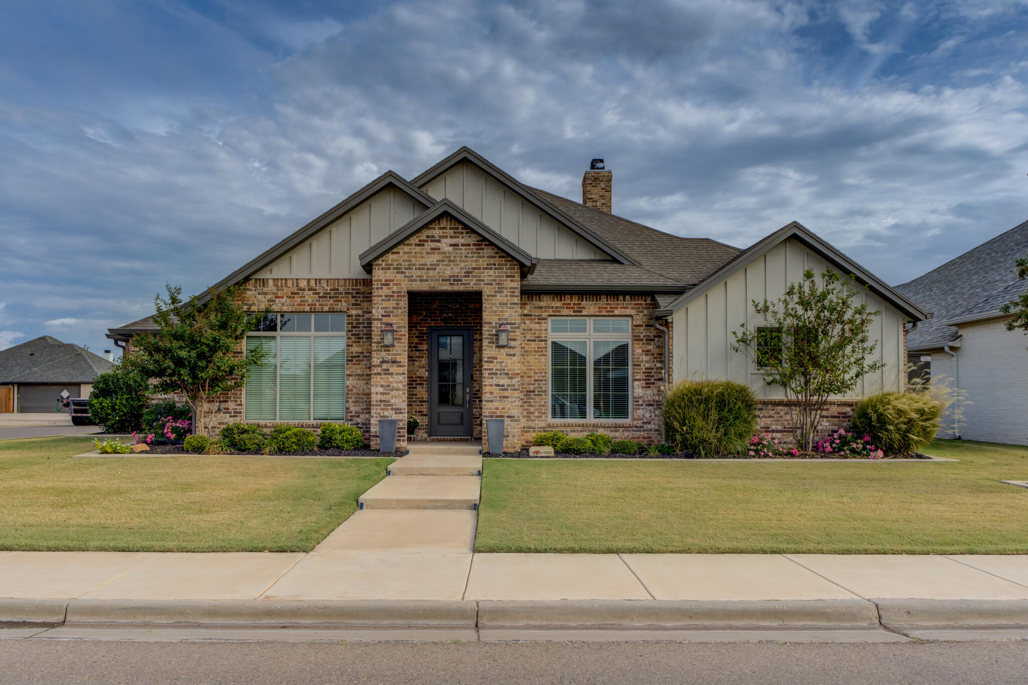 3918 137th Street Lubbock, TX 79423 - Photo 2 of 64 a front view of a house with a yard