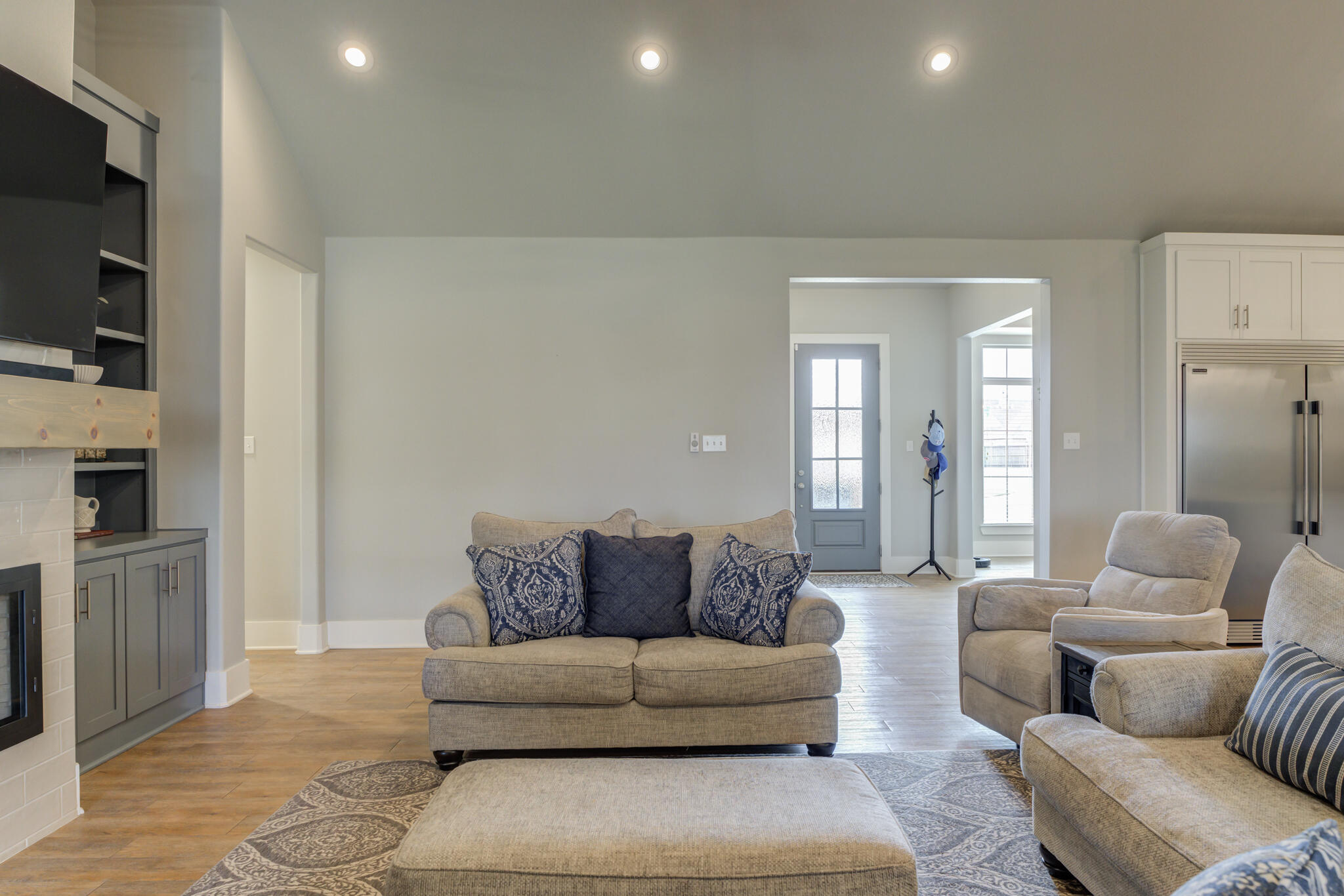 3918 137th Street Lubbock, TX 79423 - Photo 26 of 64 a living room with furniture and a flat screen tv