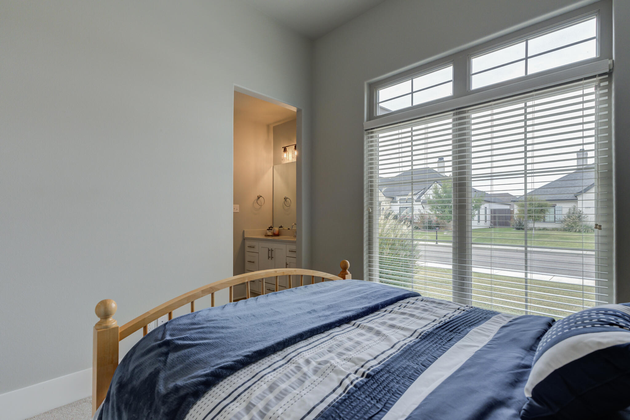 3918 137th Street Lubbock, TX 79423 - Photo 34 of 64 a bedroom with a bed and a large window