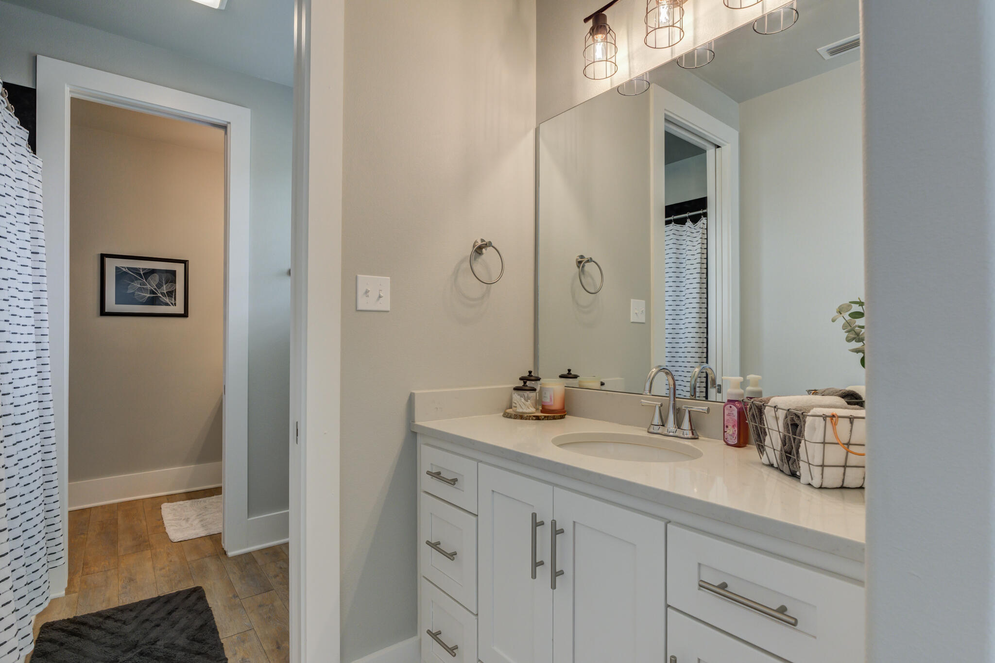 3918 137th Street Lubbock, TX 79423 - Photo 35 of 64 a bathroom with a sink and a mirror with toilet