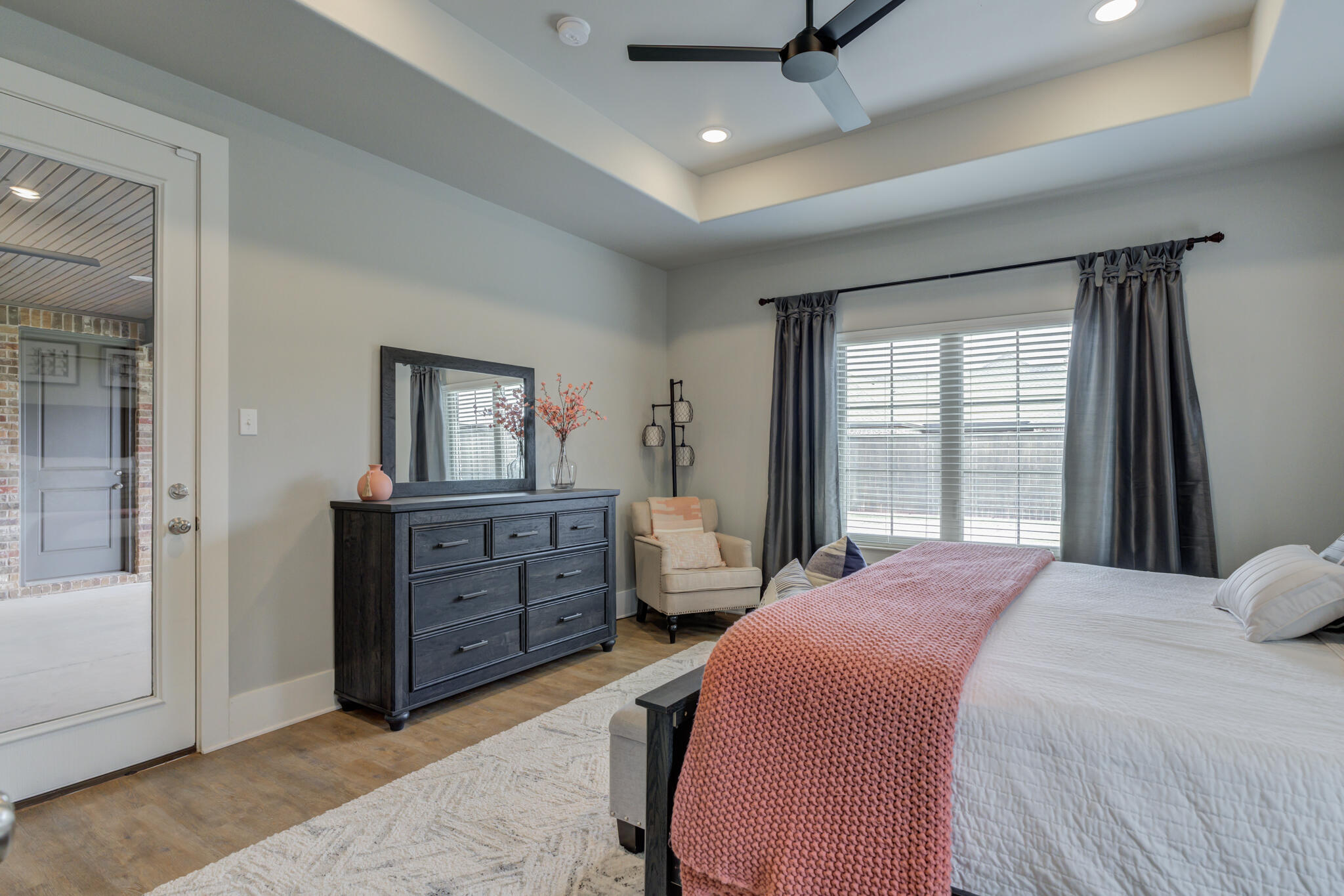 3918 137th Street Lubbock, TX 79423 - Photo 43 of 64 a bedroom with a bed and wooden floor