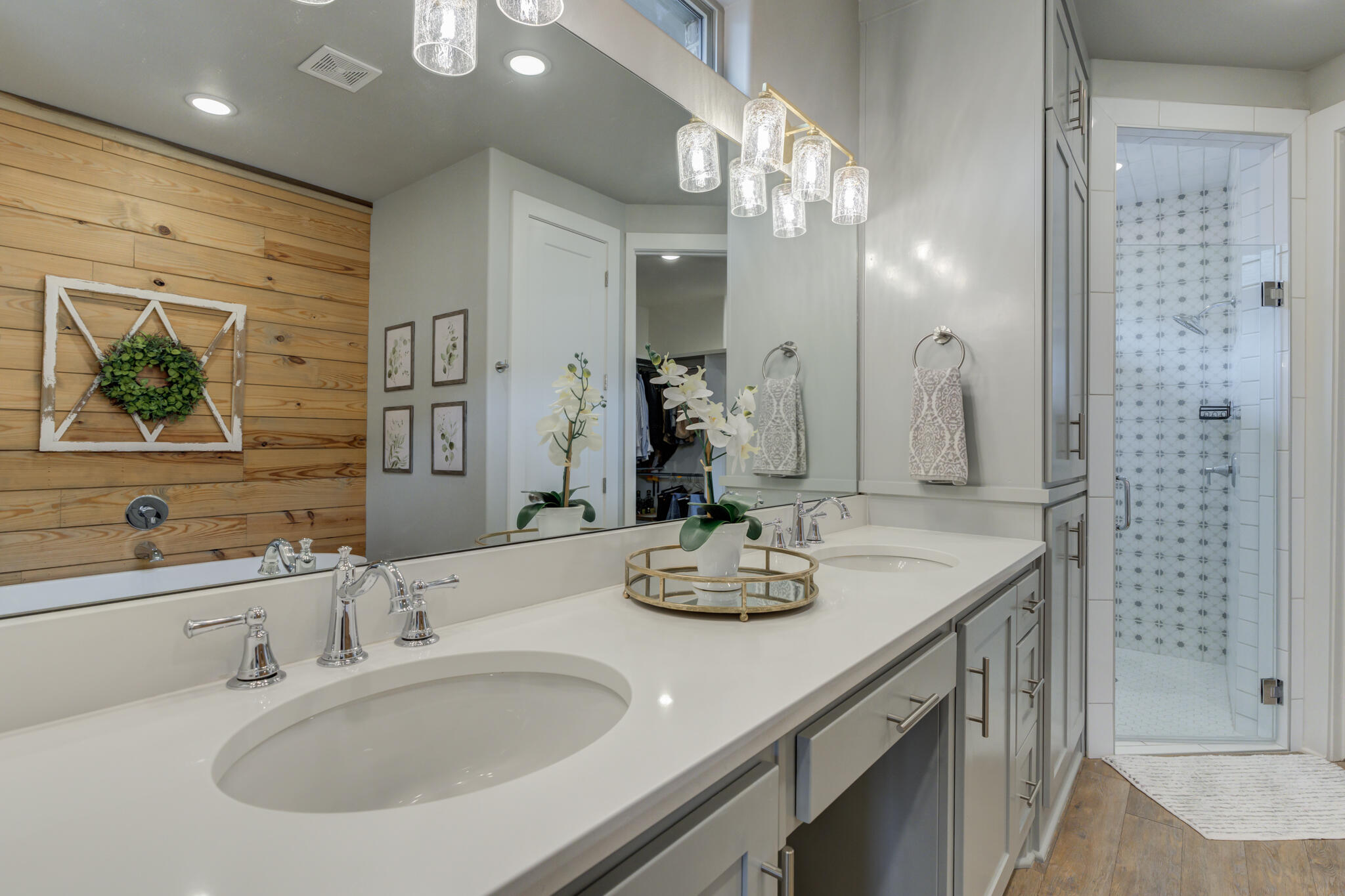 3918 137th Street Lubbock, TX 79423 - Photo 45 of 64 a bathroom with double vanity sinks and a shower