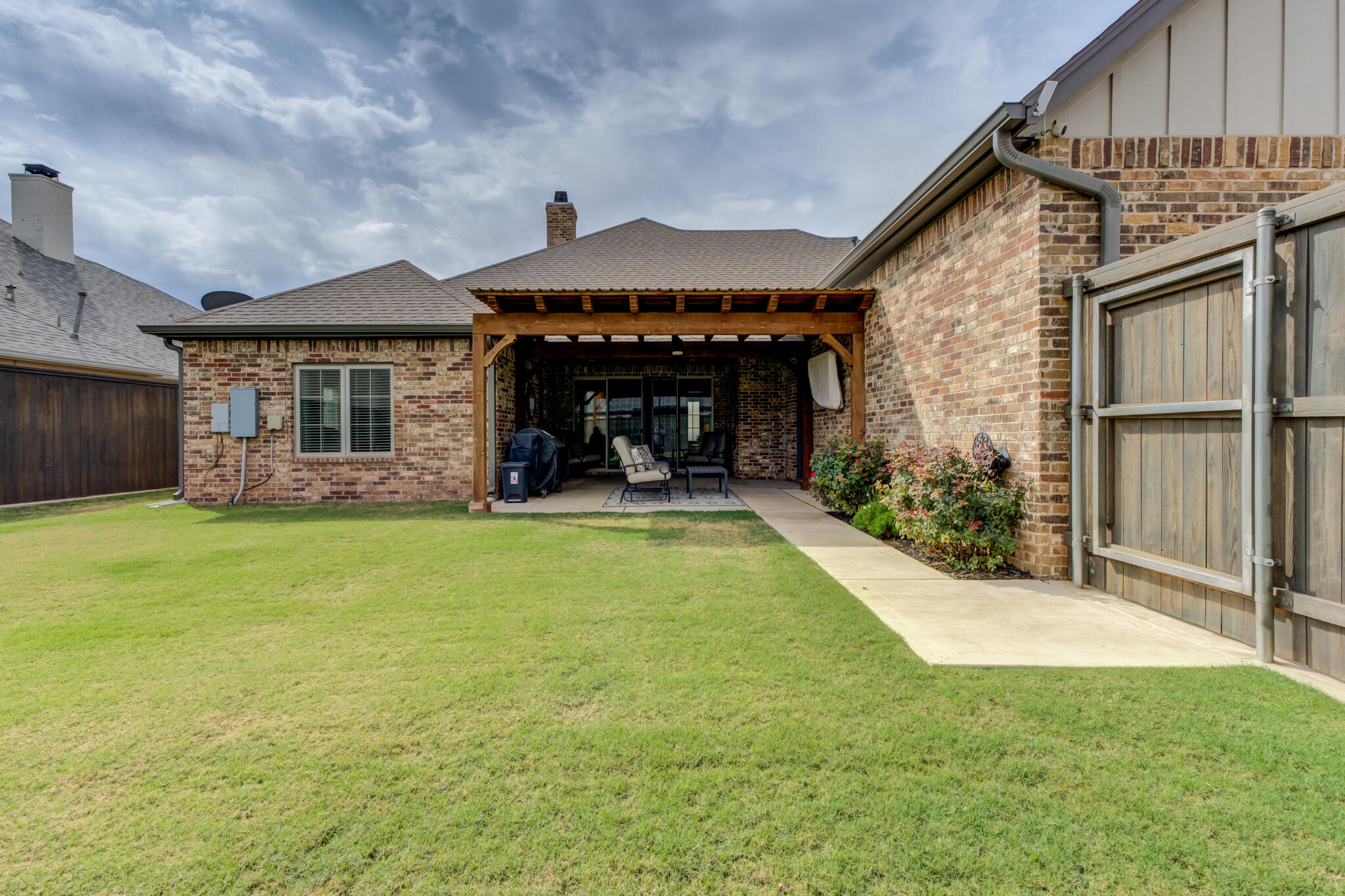 3918 137th Street Lubbock, TX 79423 - Photo 64 of 64 a view of a house with a yard and garage