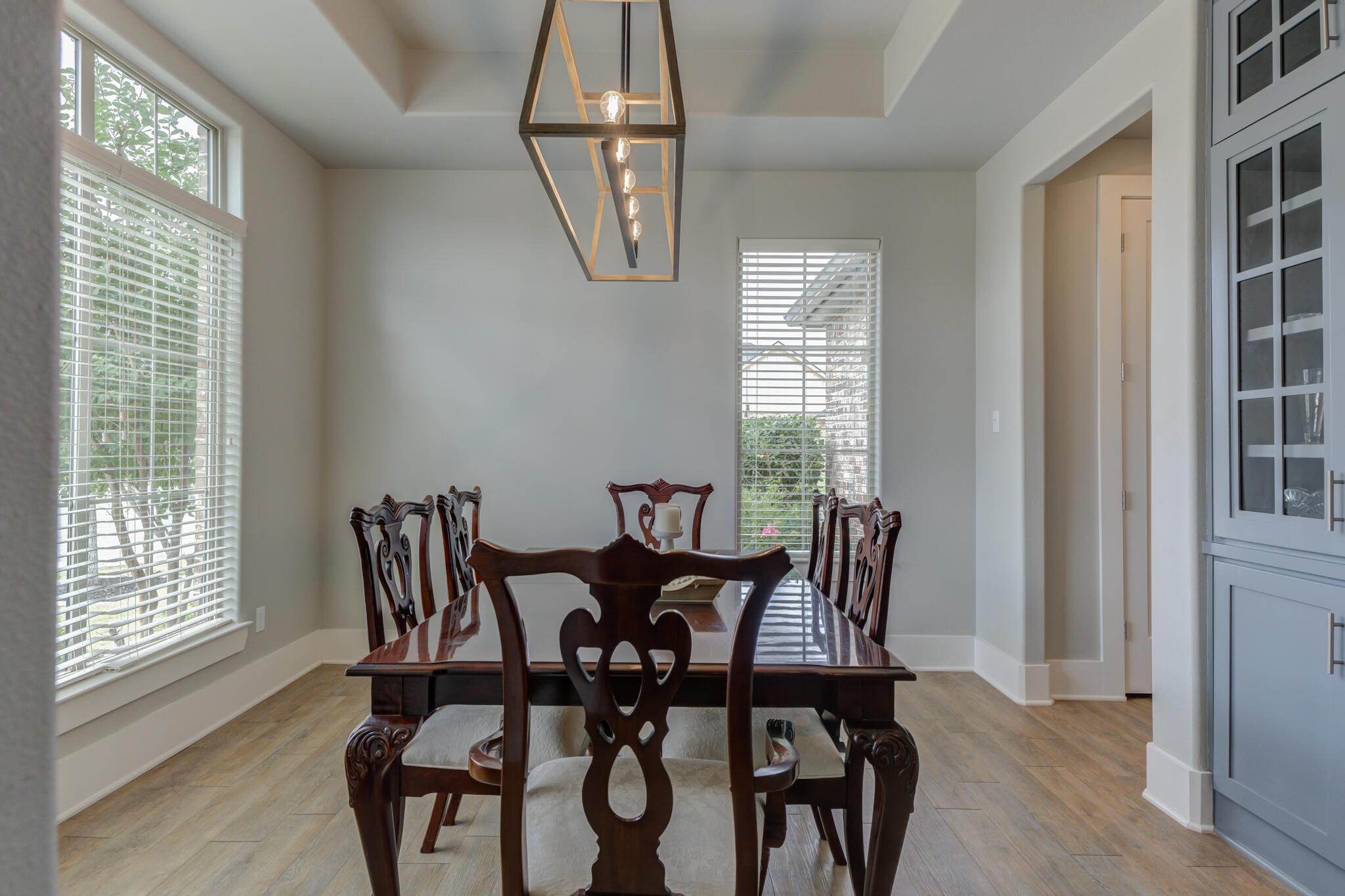 3918 137th Street Lubbock, TX 79423 - Photo 7 of 64 a view of a dining room with furniture and windows