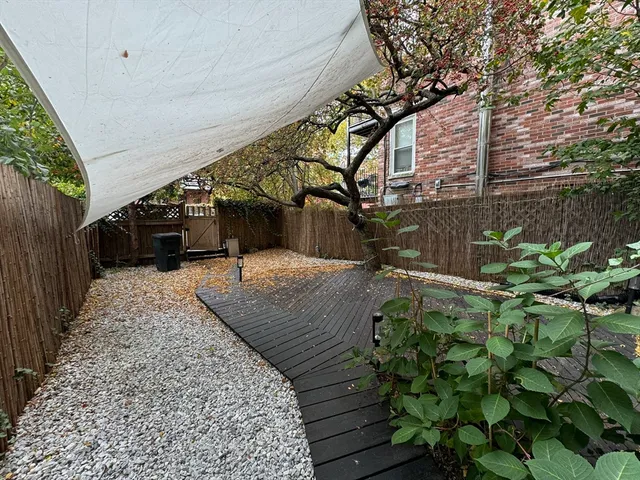 a view of a backyard of the house