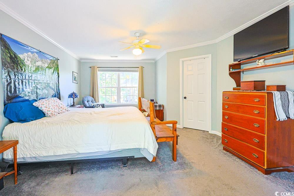 2033 Chadbury Lane Myrtle Beach, SC 29588 - Photo 14 of 39 Bedroom with ornamental molding, carpet flooring, and ceiling fan