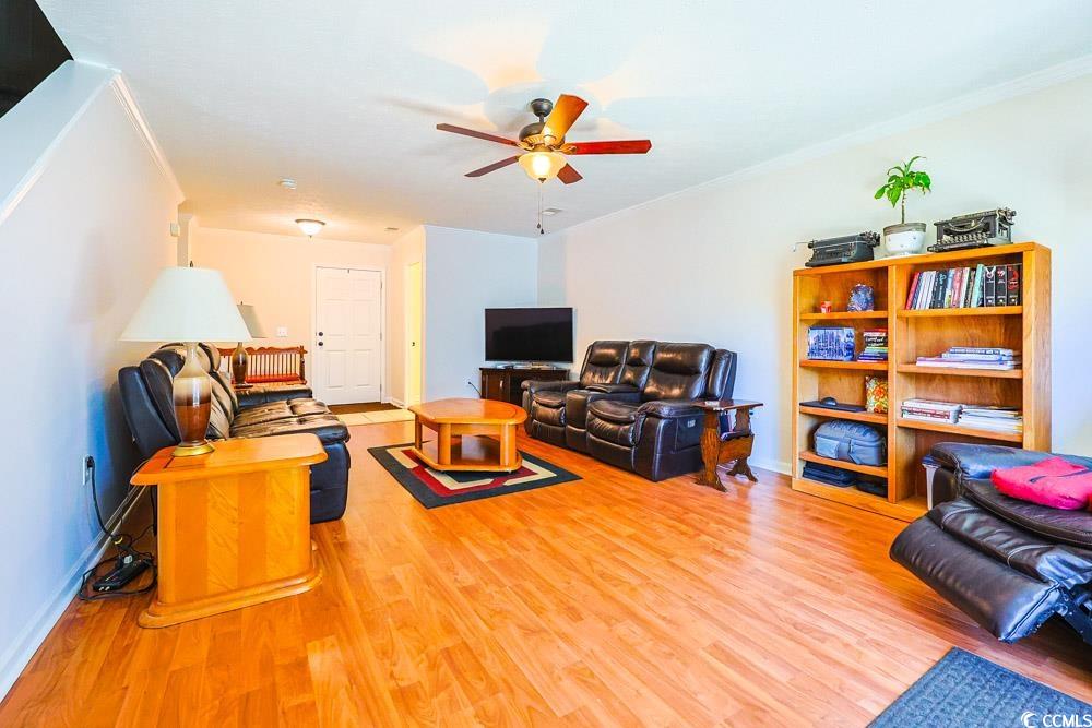 2033 Chadbury Lane Myrtle Beach, SC 29588 - Photo 2 of 39 Living area with light wood-type flooring, ceiling fan, and crown molding